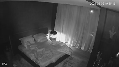 Masturbating on the bed.