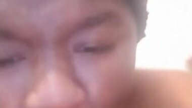 Sucking on a purple dildo