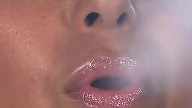 Busty desi smokes a cigarette