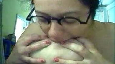 sucking her own tits