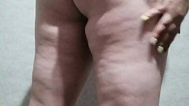 Black peignoir barely covers her ass